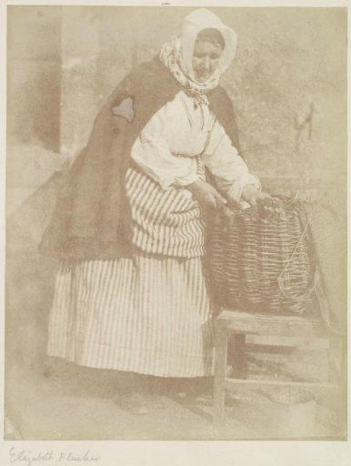 Portrait of Barbara Flucker, fisherwoman in Newhaven, by a basket of oysters