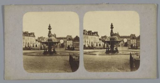 Square with fountain and triumphal arch, France