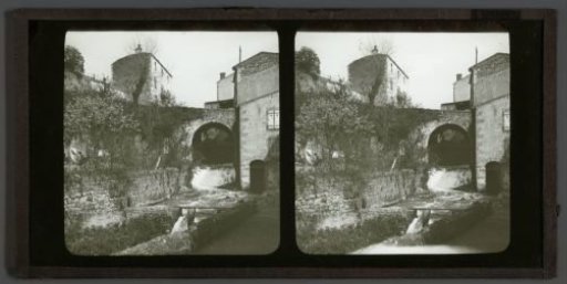 View of a stream flowing through a village
