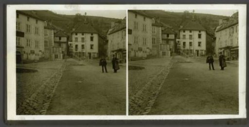 Two men on a square in Chaudes-Aigues, France