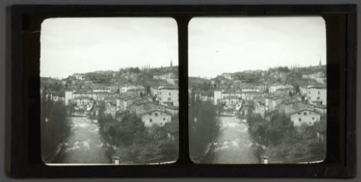 View of a mountain village on a river, probably in France