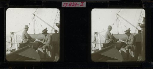 Men Sitting on the Deck of a Ship