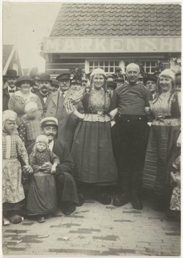 Village scene with people in costume in Marken