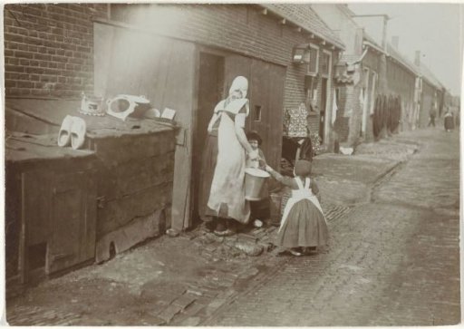 Mother and Children in Traditional Dress on the Street in Spakenburg