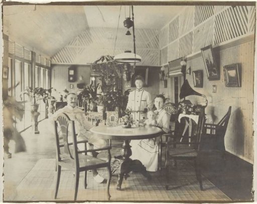Portrait of an Unknown Family at Table with an Indonesian Servant, Dutch East Indies