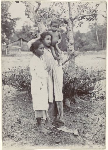 Portrait of two unknown young women and a child