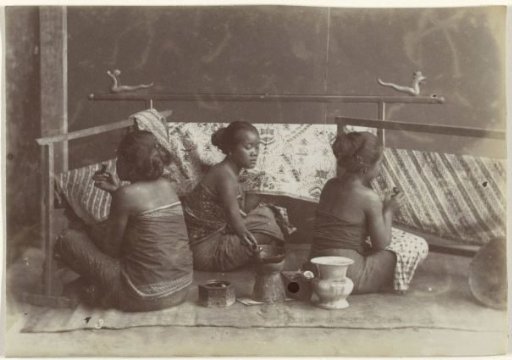 Women batikting fabric in Java