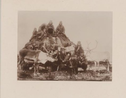 Group portrait of Sami with reindeer