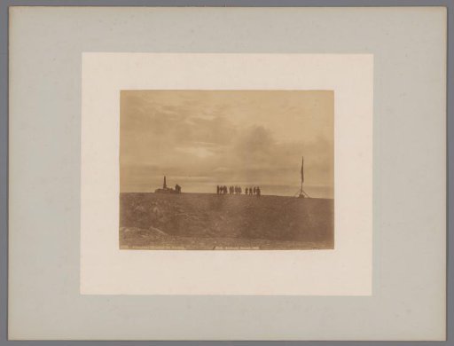 Group of people with the midnight sun at the North Cape