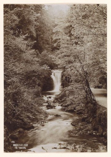 Waterfall with standing boy