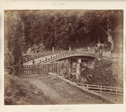 Bridge over a river near Nikko, right a torii