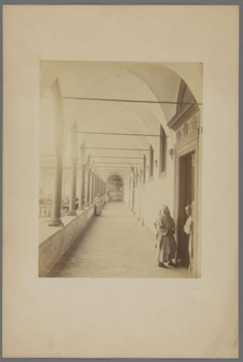 Four monks in the cloister of the monastery church in Pavia