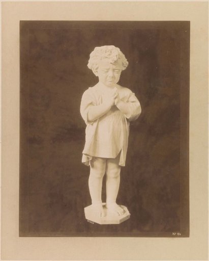Sculpture of a crying child with folded hands