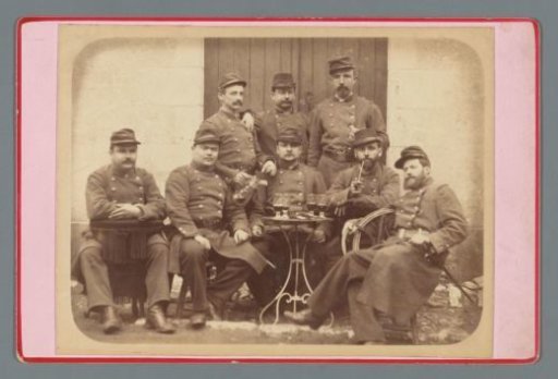 Group portrait of seated soldiers drinking wine