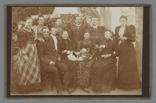 Family Portrait Outdoors Around a Tea Table