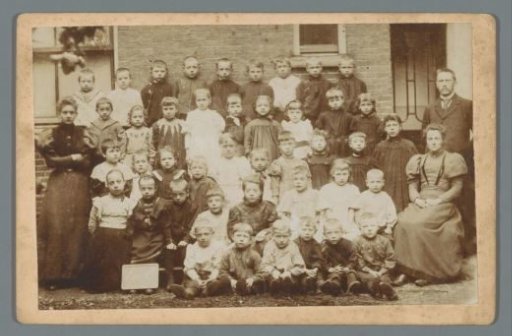 Group Portrait of Children with Several Adults