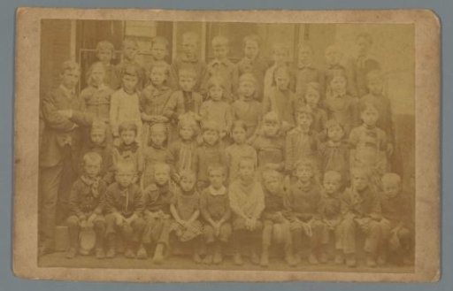 School photograph of children with a teacher