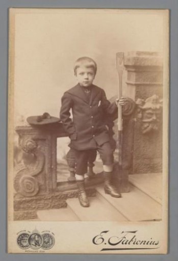 Portrait of a boy with a shovel