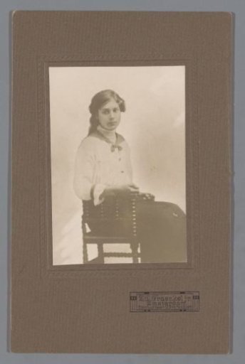Portrait of an unknown woman seated on a chair