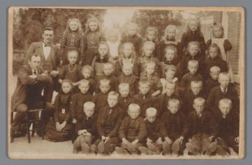 School photograph of children with two teachers