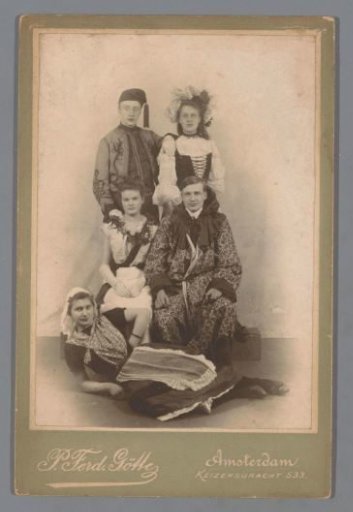 Group portrait of young men and women in costume and dress