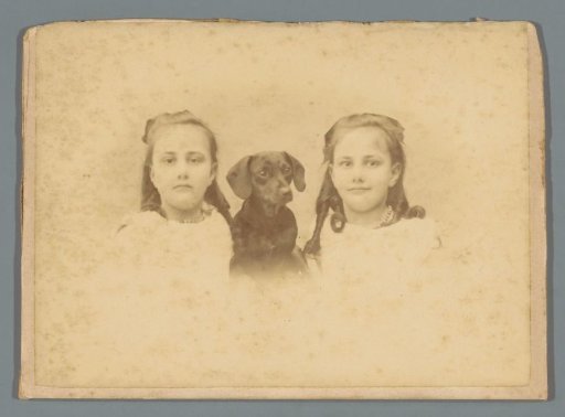 Portrait of two girls and a dog