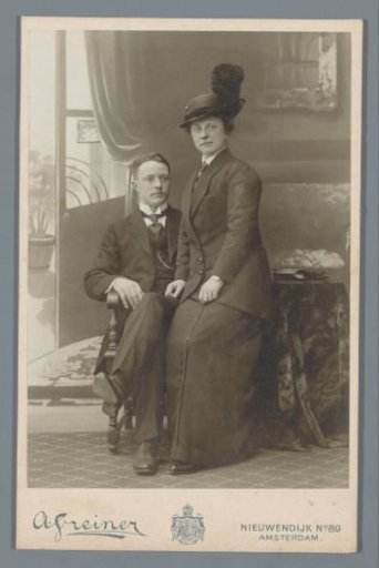 Portrait of an unknown woman on the lap of an unknown man