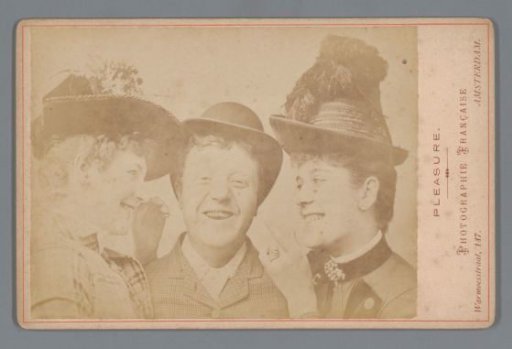 Portrait of a laughing man and two laughing women