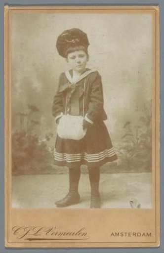 Studio portrait of an unknown girl with a muff