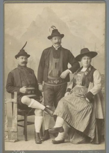 Group portrait of two men and a woman in Tyrolean costume