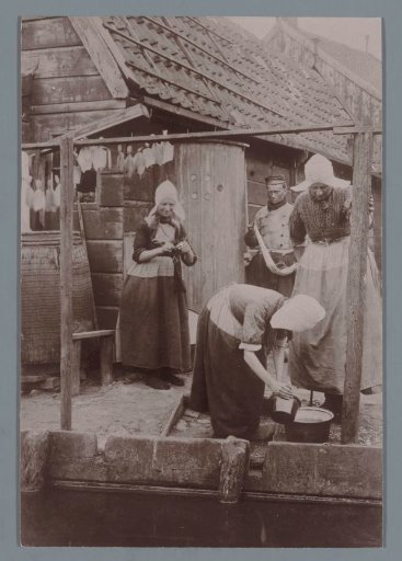 Portrait of Women and a Man in Traditional Dress in Muiden