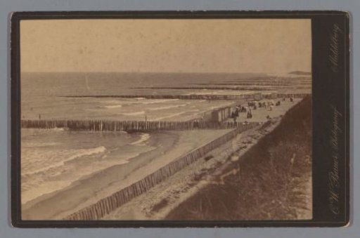View of the Zeeland beach with sea defenses and bathing cabins