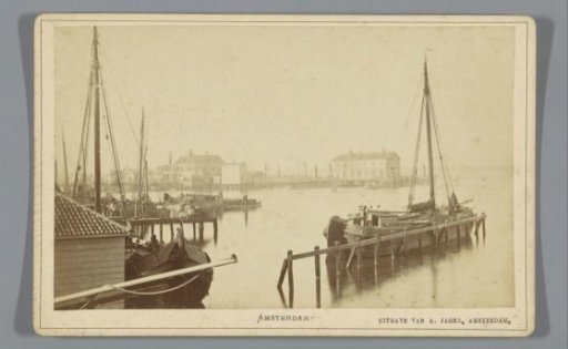 View of the Nieuwe Stadsherberg and harbour of the IJ in Amsterdam