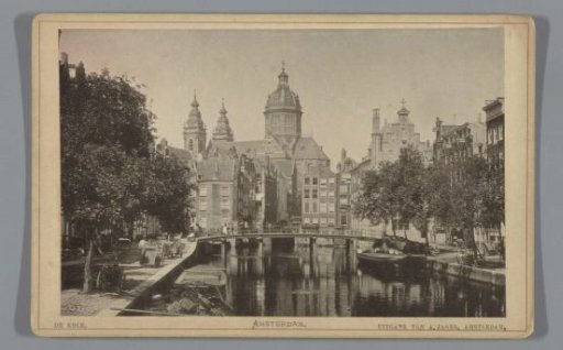 View of the Oudezijds Kolk with the Armbrug and the Nicolaaskerk in the background in Amsterdam