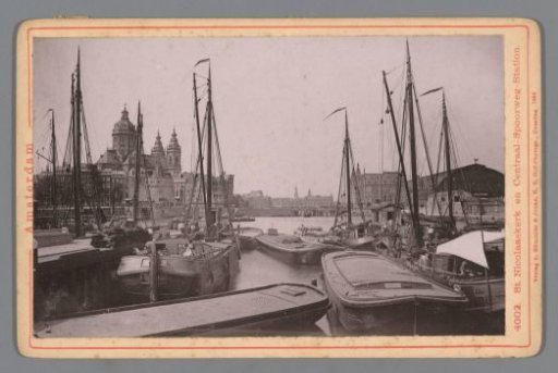 View of the Oosterdok in Amsterdam, with the Saint Nicholas Church on the left and the Central Station on the right
