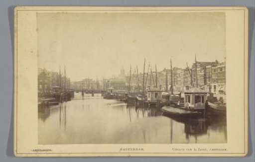 View of the Damrak and the Corn Exchange in Amsterdam