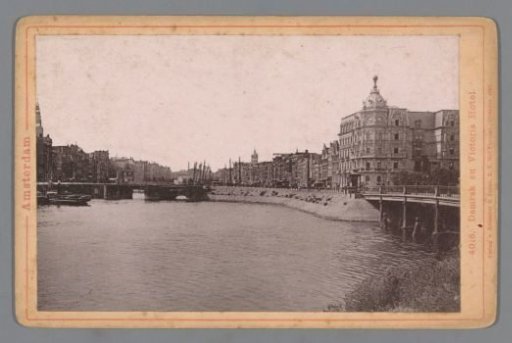 View of the Damrak and Victoria Hotel in Amsterdam