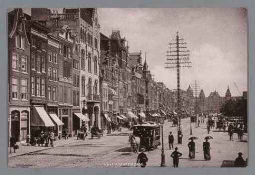 View of the Damrak in Amsterdam, with the Central Station in the background