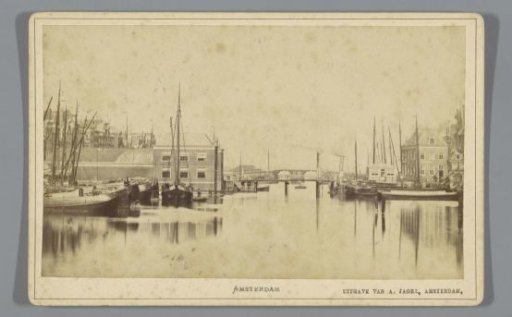 View of the rear of the Corn Exchange, the Oude Brug and the Nieuwe Brug in Amsterdam, seen from the Damrak