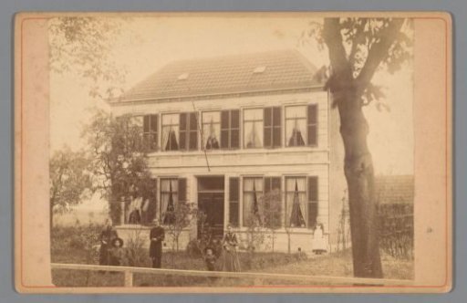 Family in the front garden of a country house in the Netherlands