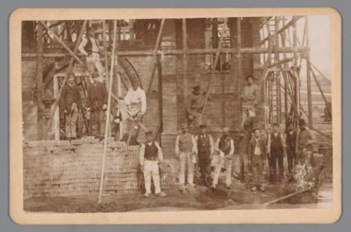 Construction workers posing on a construction site, probably in the vicinity of Groningen