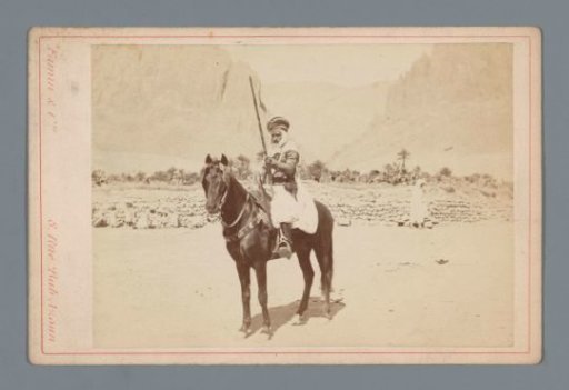 Arab man on horseback with a rifle