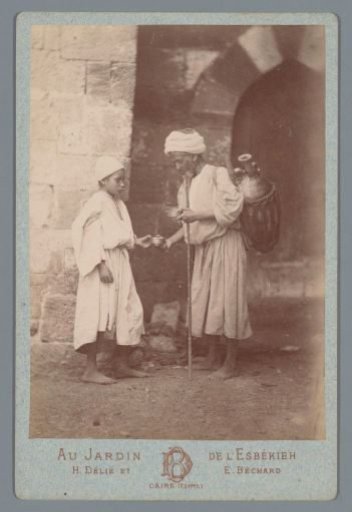 Man and boy with jug and cups