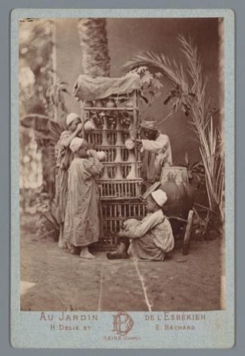 Boys at a rack with jugs