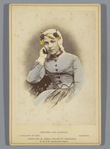 Portrait of an unknown woman with headdress and necklace according to the costume of Krommenie, North Holland