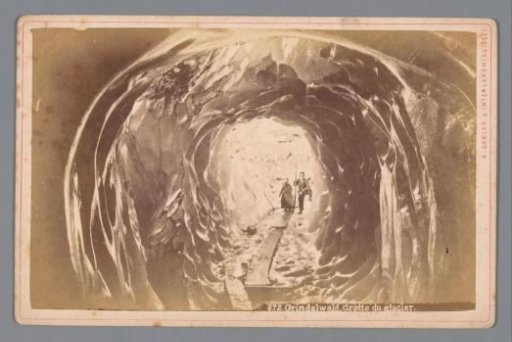 People in a cave on the Grindelwaldgletscher in Switzerland