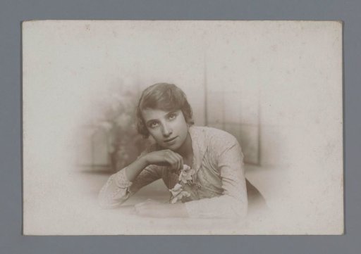 Portrait of an unknown young woman holding lilies