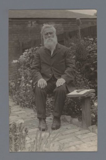 Portrait of an unknown elderly man in a garden