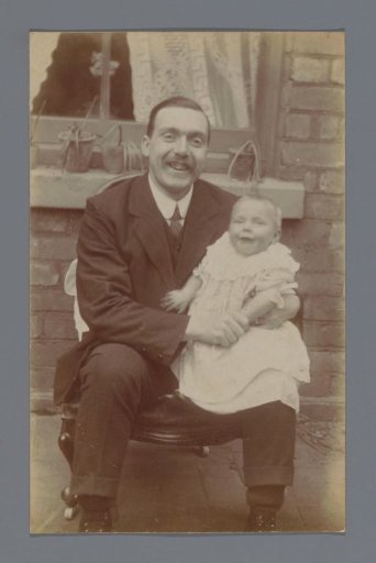 Portrait of an unknown man with a baby