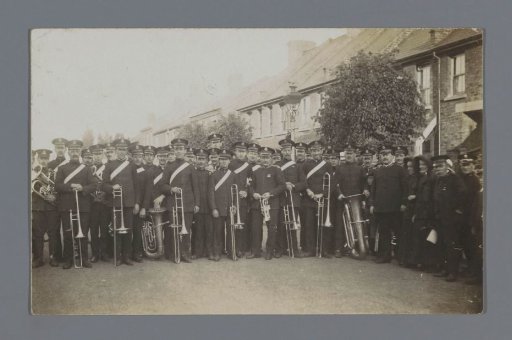 Group portrait of members of the Salvation Army with brass instruments